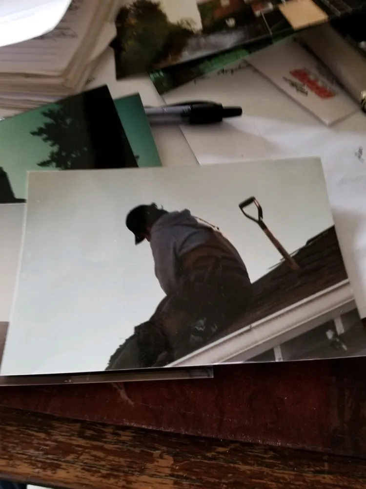 Slide of Andy's Roofing Company