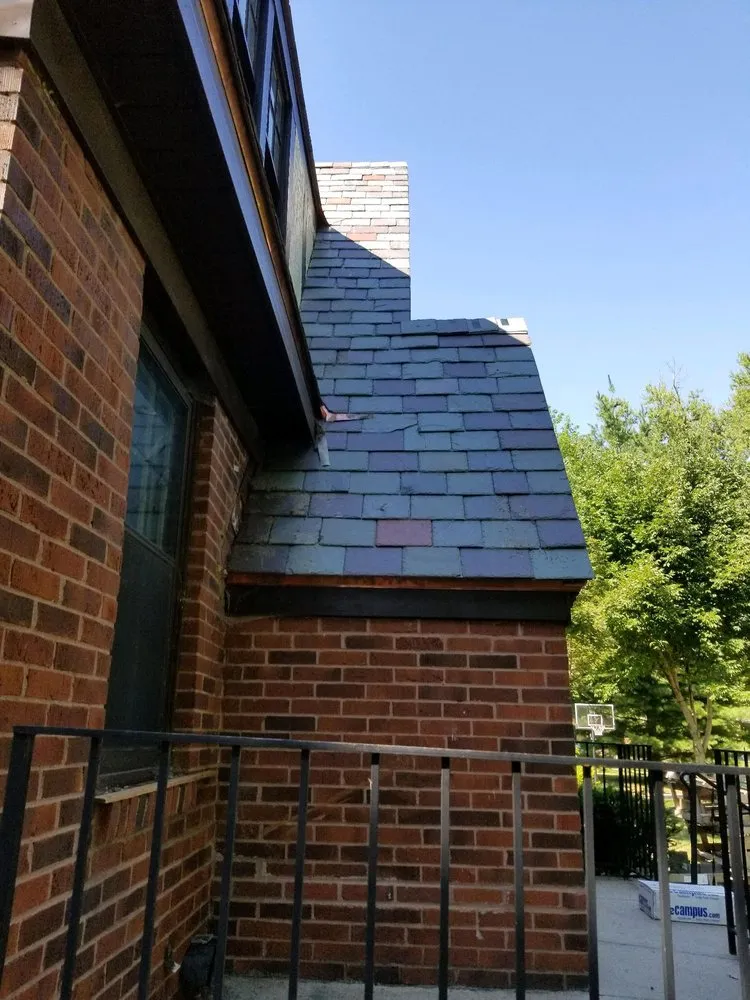 Slide of Andy's Roofing Company