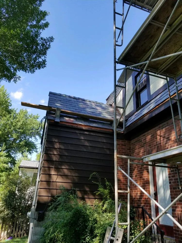 Slide of Andy's Roofing Company