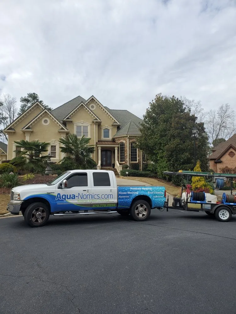 Slide of Aqua-Nomics Pressure Washing and Roof Cleaning