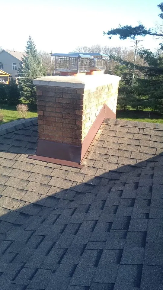 Emergency storm damage roof repair in New Hudson, MI by Armor Roofing