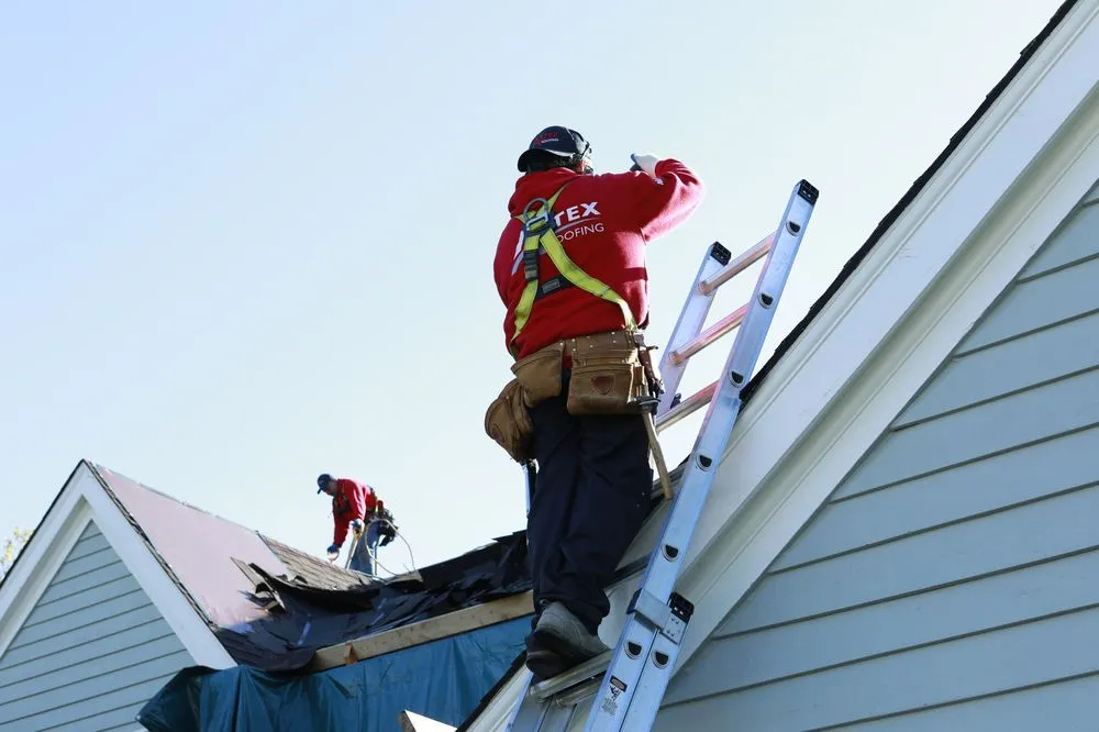 Slide of Artex Roofing