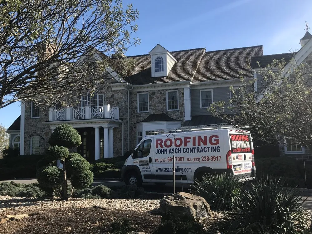 Slide of Asch Roofing