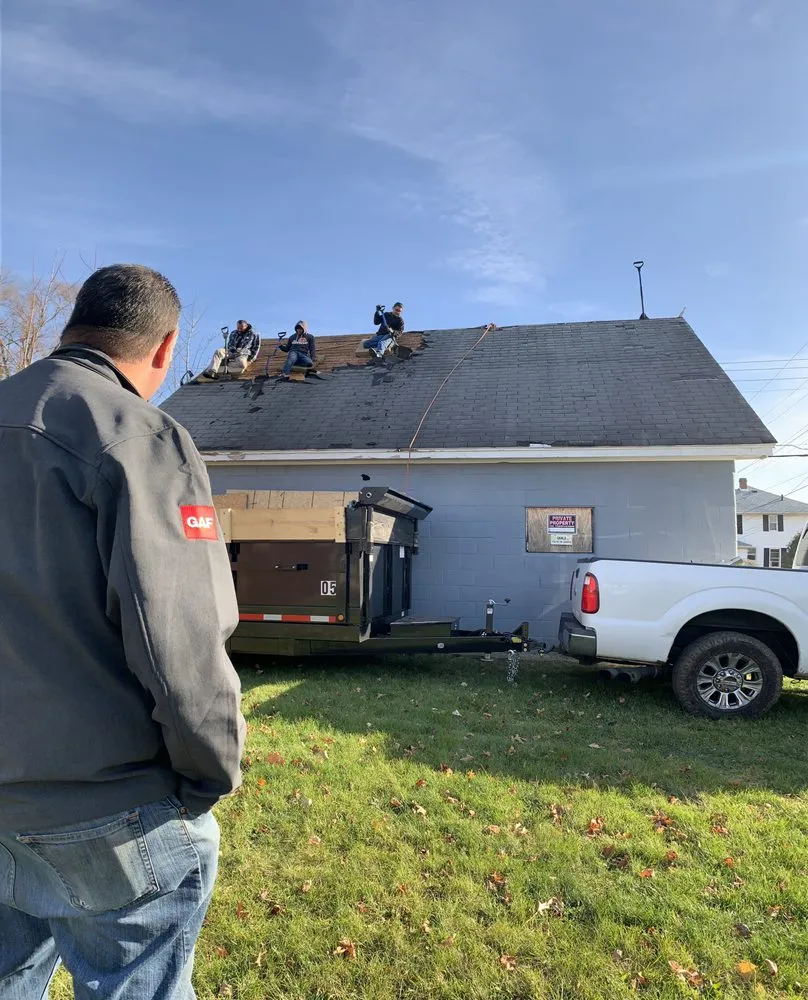 Slide of Asscher Roofing