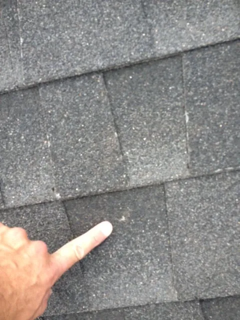 Slide of Austin Martin Roofing