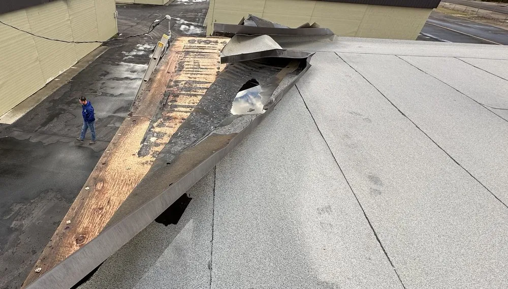 Slide of B E Roofing