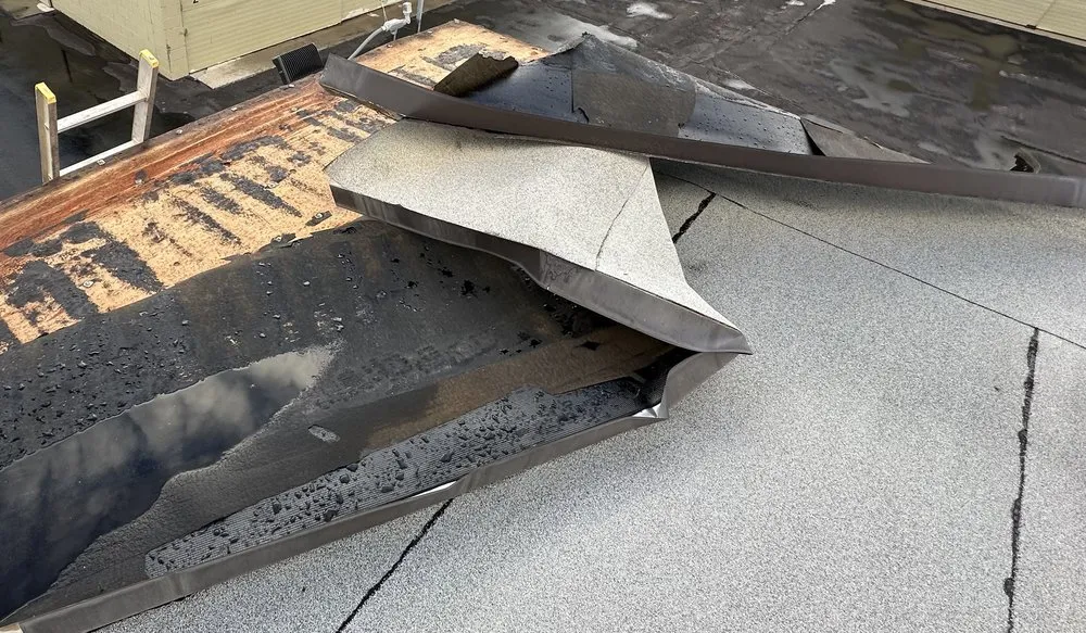 Slide of B E Roofing