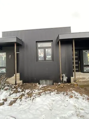 Bam Siding & Gutters Logo