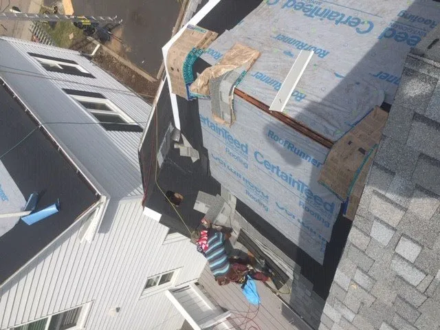 Slide of Bardi's Construction Up On The Roof