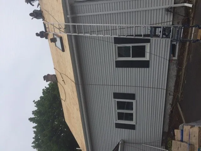 Slide of Bardi's Construction Up On The Roof