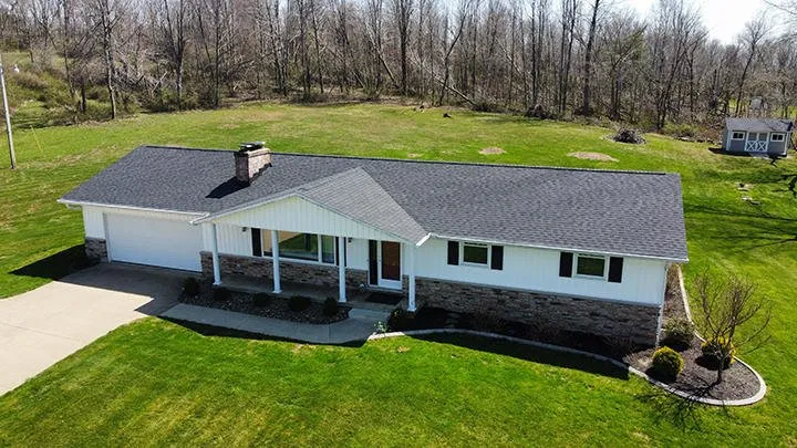 Reliable roof repair after storm damage in Holmesville, OH by Benton Roofing