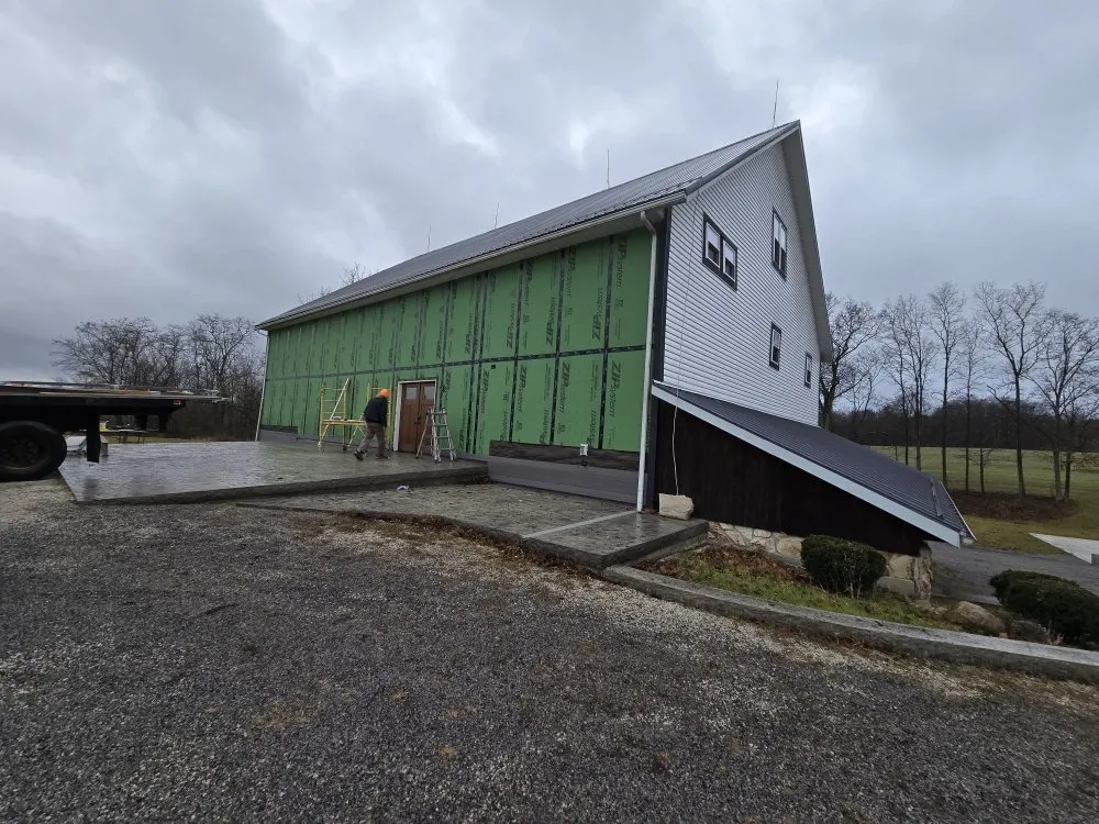 Licensed roof repair after storm damage in Homeworth, OH by Berlin Restoration