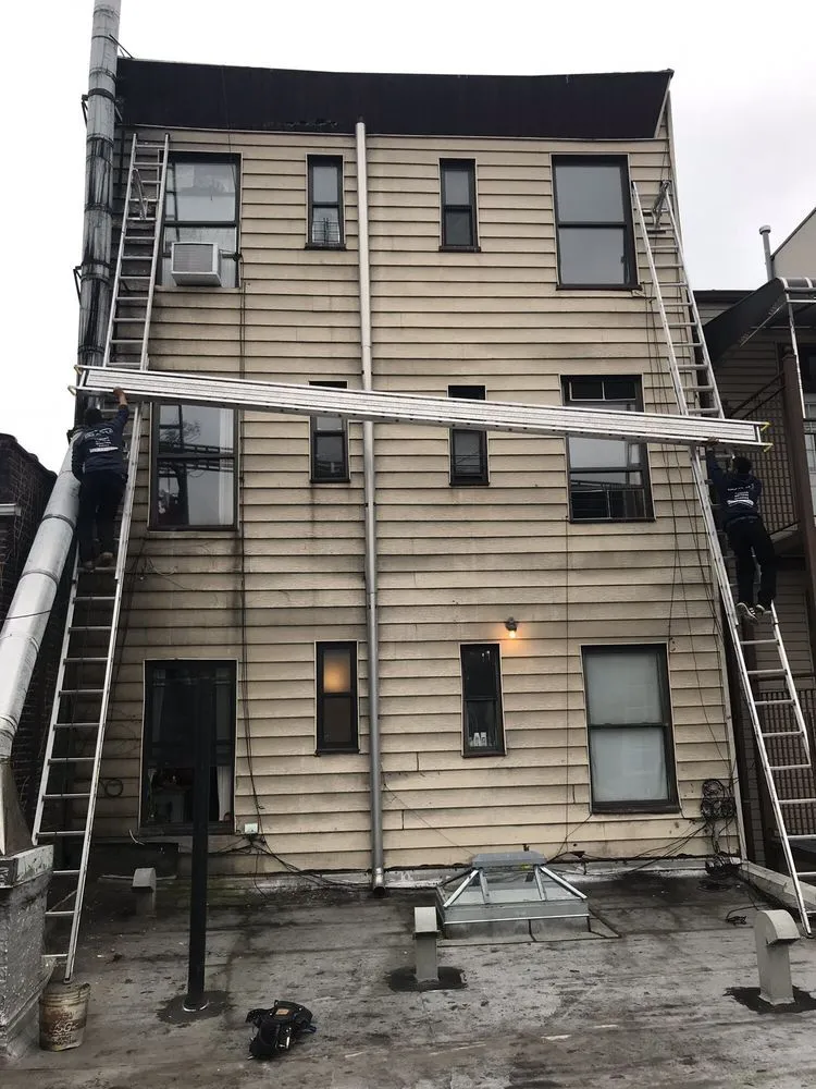 Slide of Big Apple Renovators - Queens