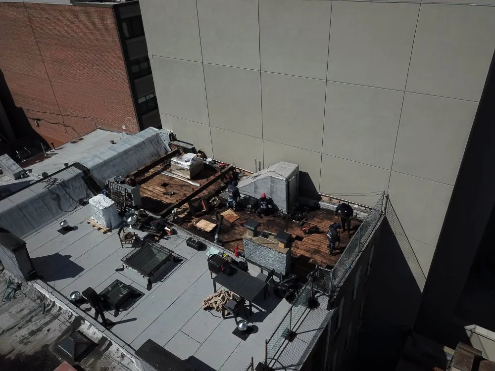 Slide of Big Apple Renovators - Queens