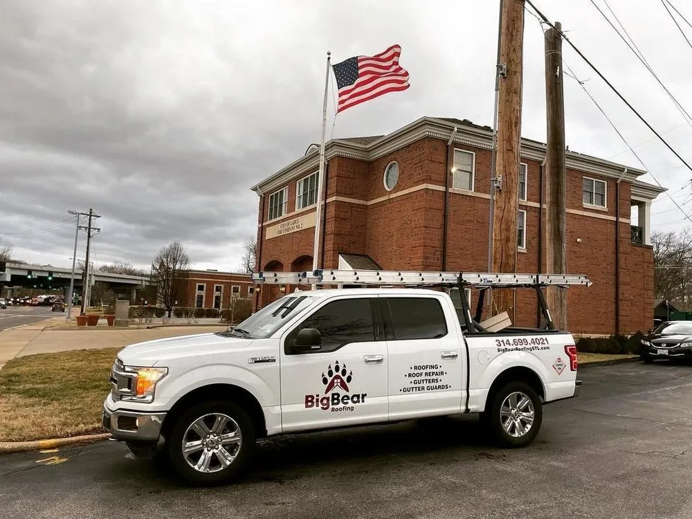 Licensed flat roof repair after storm damage in St. Louis, MO by Big Bear Roofing & Construction