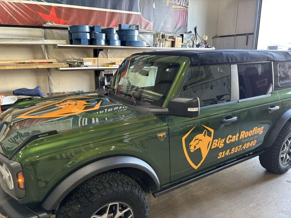 Slide of Big Cat Roofing