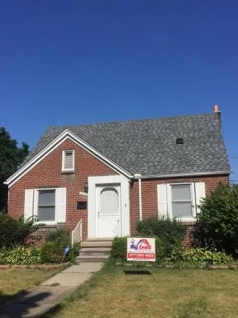 Slide of Big Ikes Roofing