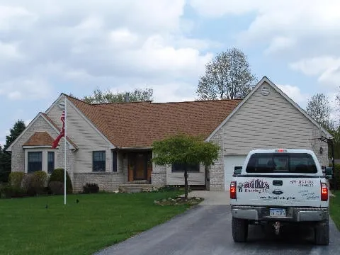 Slide of Big Ike's Roofing