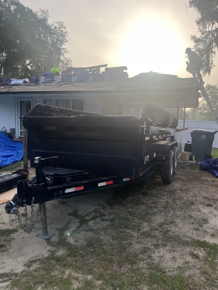 Slide of Big Jon Dumpster Services