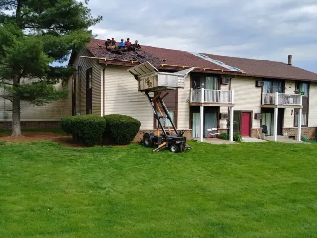Professional storm damage roof repair in Alden, MI by Billy White Roofing