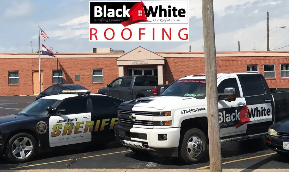 Slide of Black & White Roofing