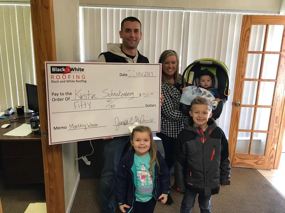 Slide of Black & White Roofing