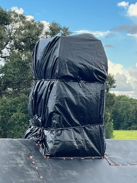 Slide of Blue Tarp Express