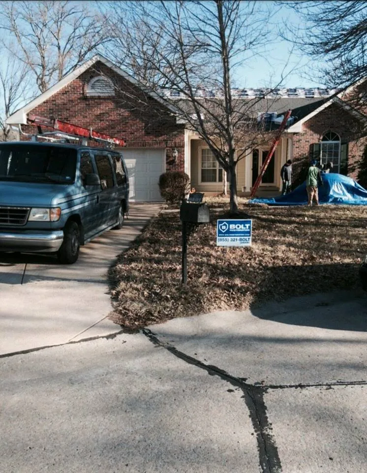 Professional storm damage roof repair same-day service in St. Louis, MO by BOLT Construction & Roofing