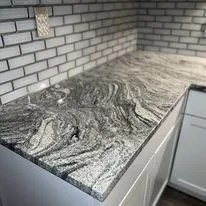 Slide of Boots On The Ground Construction & Investments