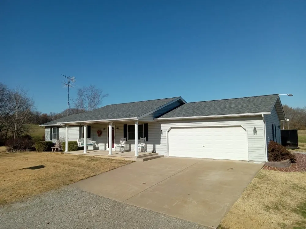 Local storm damage roof repair for fast service in Cutler, IL by Bottom to the Top Construction