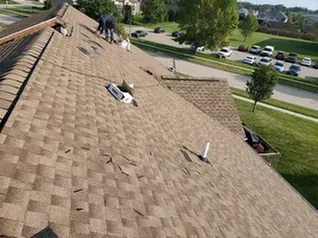 Reliable shingle roofing service after storm damage in Farmersburg, IA by Brainard Roofing Company