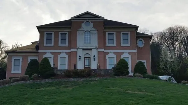 Bryan Dennis Roofing and Construction Logo