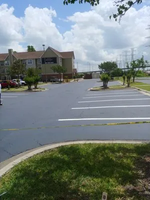 Budget Roofing and Construction Logo