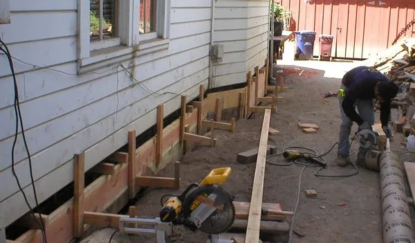 Built tough Masonry And Roofing Logo