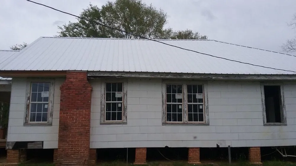 Slide of Burkett Brothers Metal Roofing