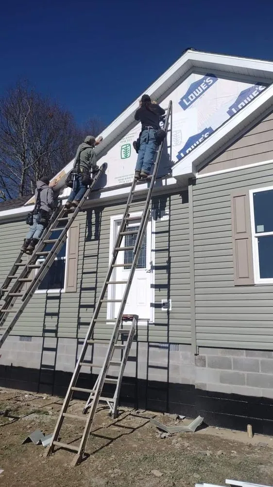Local storm damage roof repair in Tunnelton, WV by C W Construction