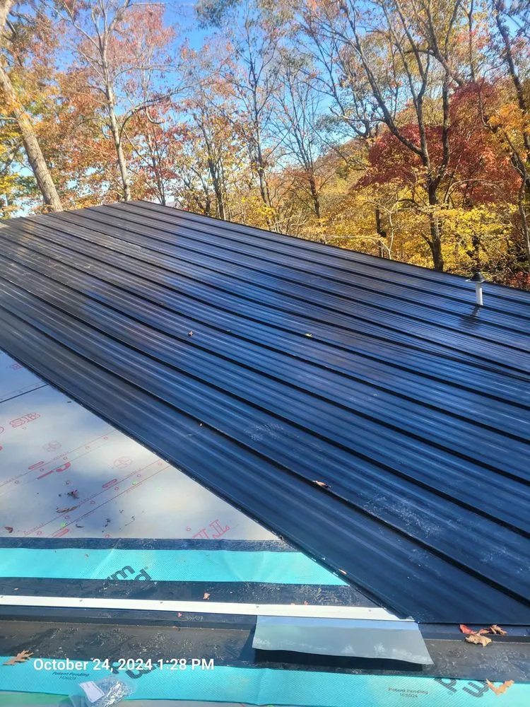 Slide of Cameron Reese Metal Roofing Construction