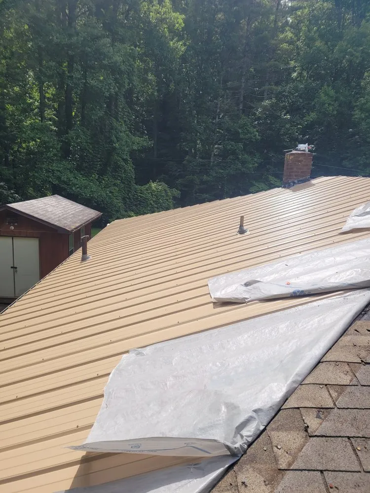 Slide of Cameron Reese Metal Roofing Construction