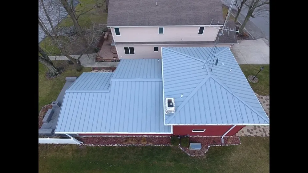 Professional metal roofing installation after storm damage in Camden, MI by Carbon Construction Company