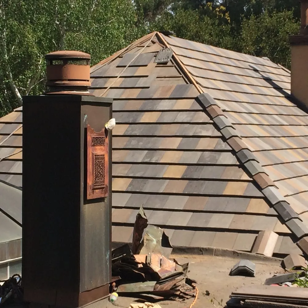 Slide of Caruzo's Roofing Contractors