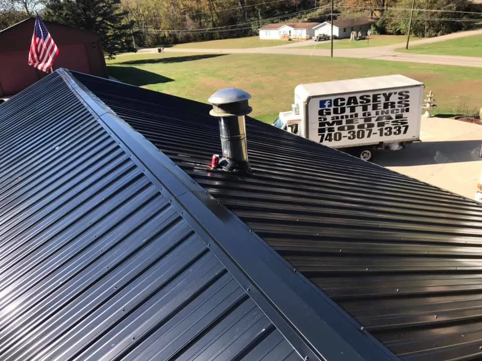 Slide of Casey’s Continuous Gutters and Metal Roofs