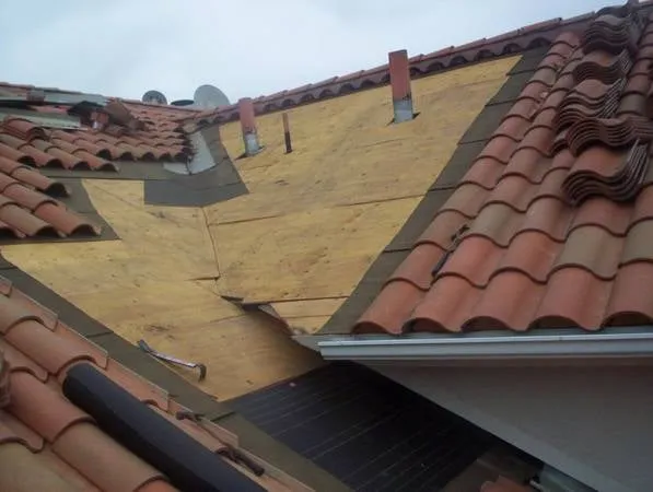 Slide of Caye Works Roofing