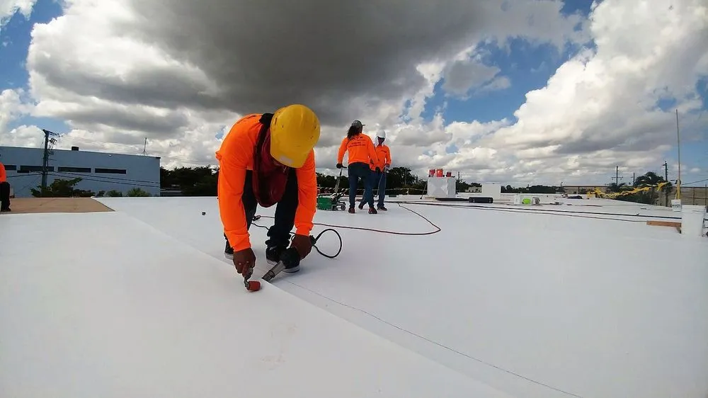 Slide of Caye Works Roofing