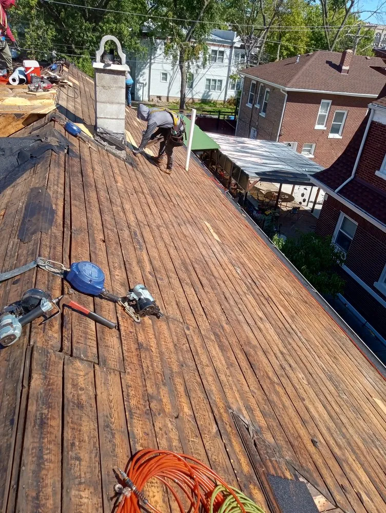 Slide of CC The Roof Guys