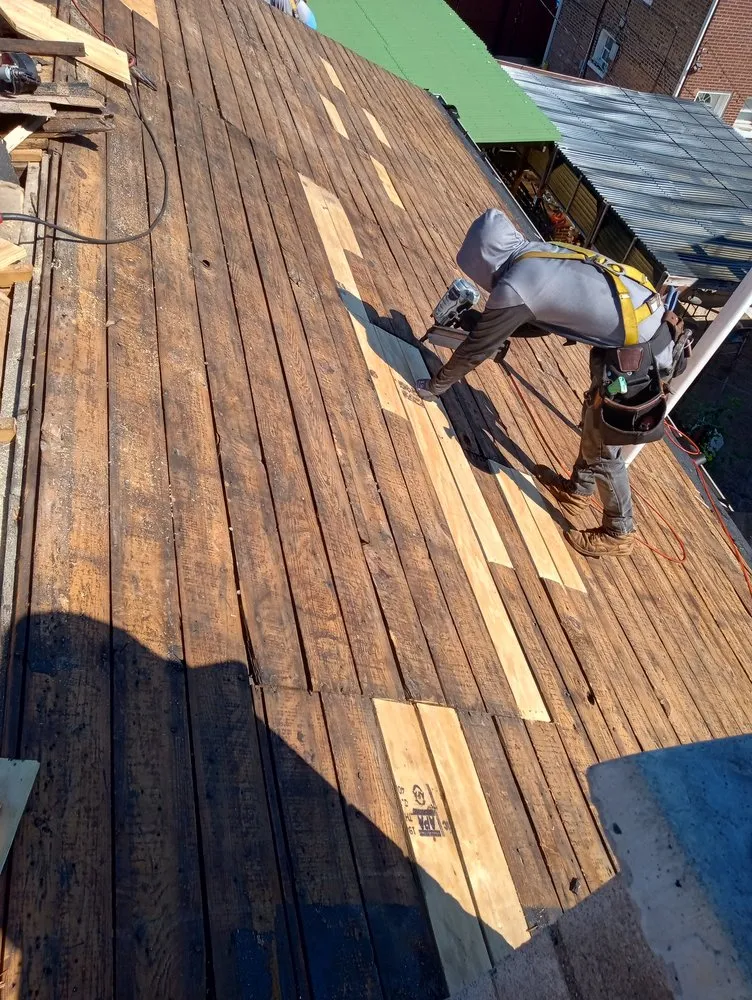 Slide of CC The Roof Guys