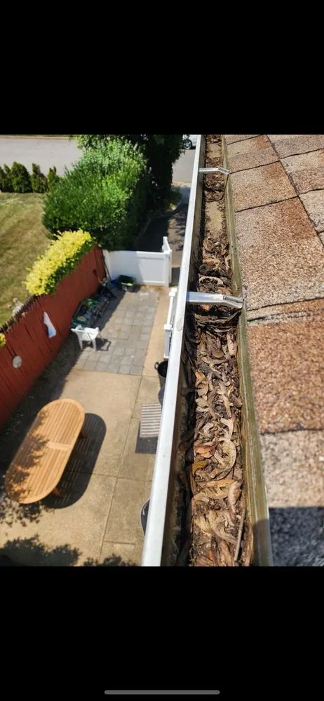 Slide of Central Islip Gutter Clean and Repair