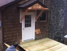 Reliable flat roof repair after storm damage in Woodbury, VT by Champlain House Doctors Inc
