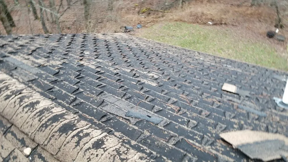 Slide of Champlain Roofing