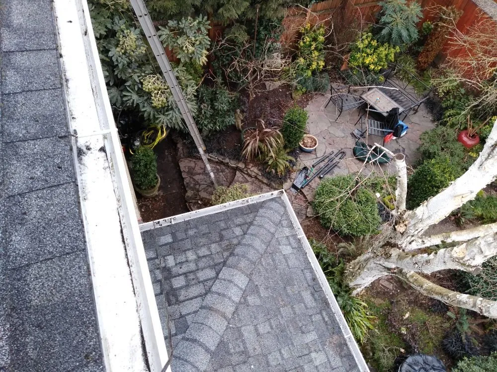 Slide of Charity's Roof and Gutter Cleaning