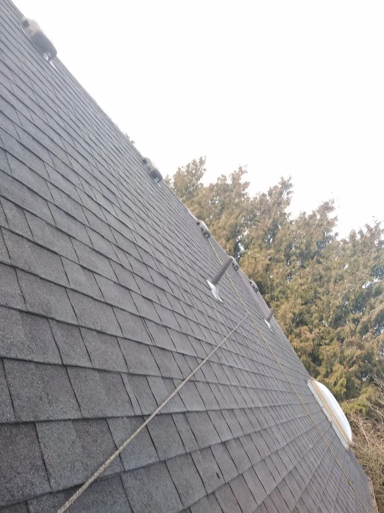 Slide of Charity's Roof and Gutter Cleaning